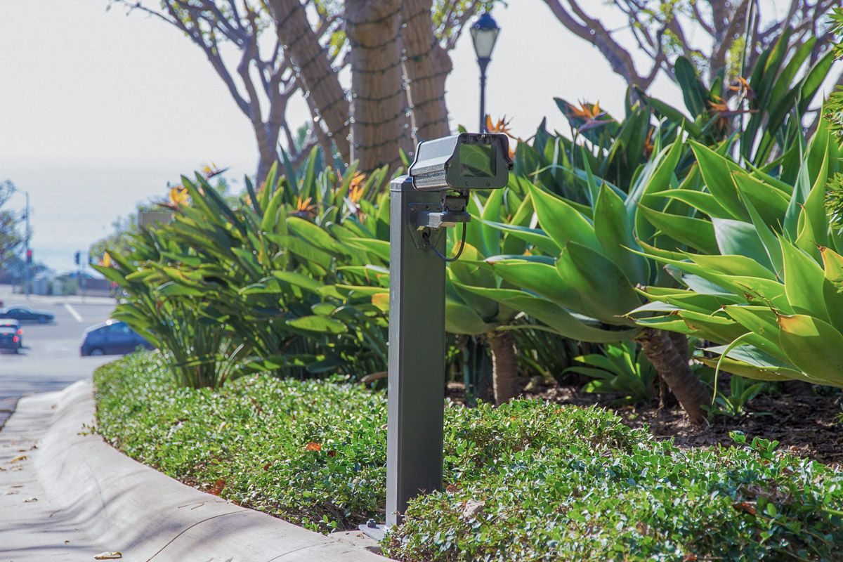 Mounted surveillance camera with license plate recognition.